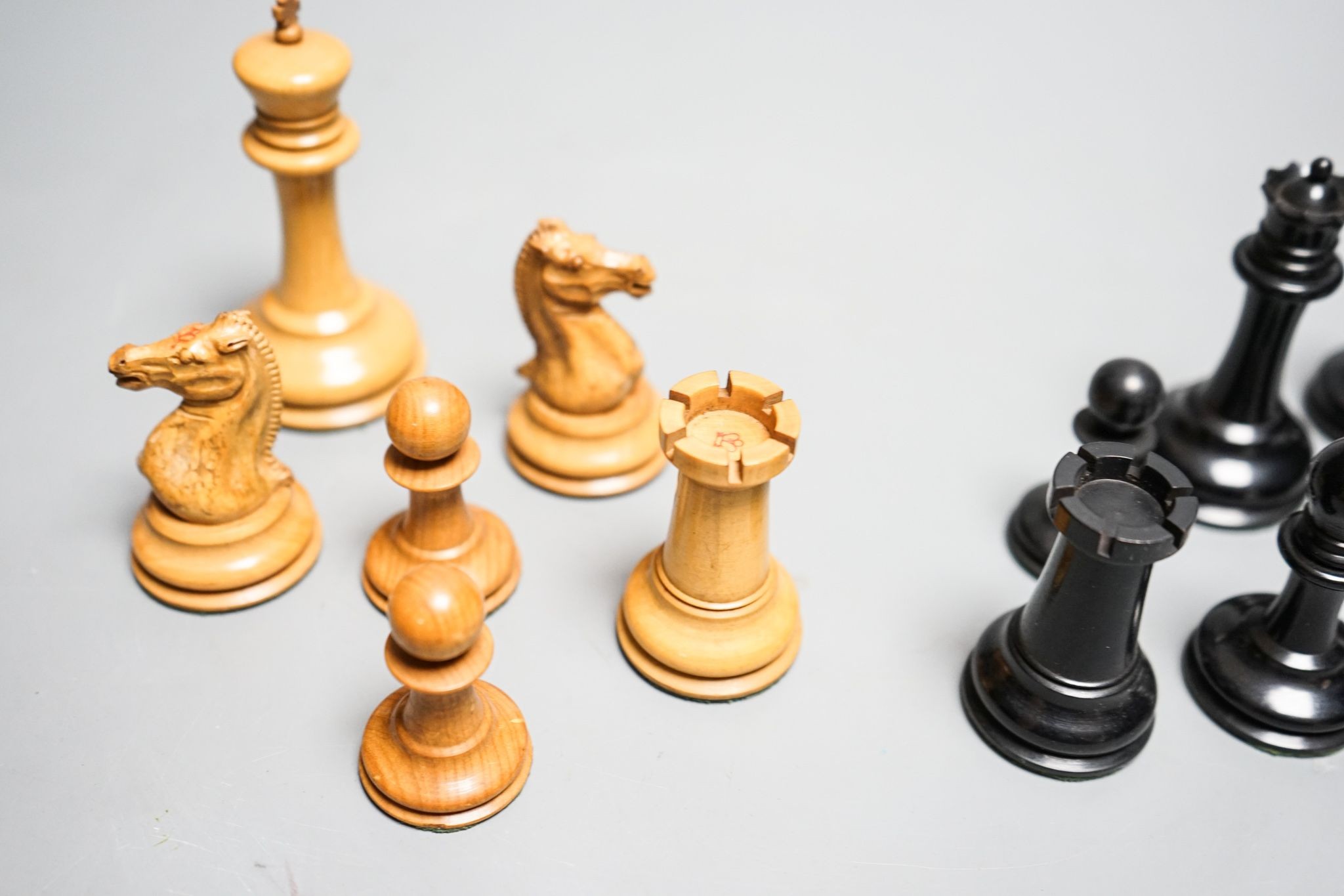 A boxed Jaques Staunton boxwood and ebony chess set, White king stamped Jaques London, 8.5cm high